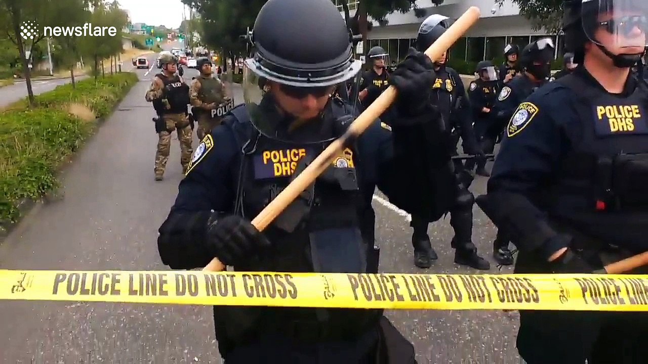 ICE protester in Portland films barricade of federal officers in riot gear