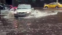 A kind man saved this poor kitten who stand alone in a flooded street while it's raining heavily during a huge storm .... Thank you guys and God bless you all!