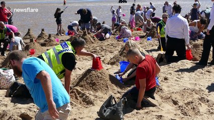 Police lend a hand to try to break sandcastles record in Cleethorpes