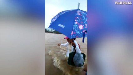 Hero Teachers Wade Through Flooded River To Reach School