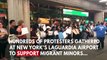 Protesters Gather At LaGuardia Airport To Greet Migrant Children Arriving In New York