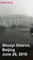 A severe storm suddenly hit Shunyi District in northeast Beijing on Tuesday afternoon. 63 flights were canceled at the Beijing Capital Airport, with wind tearin