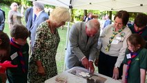 Prince of Wales and Duchess of Cornwall make clay poppies in Monmouthshire