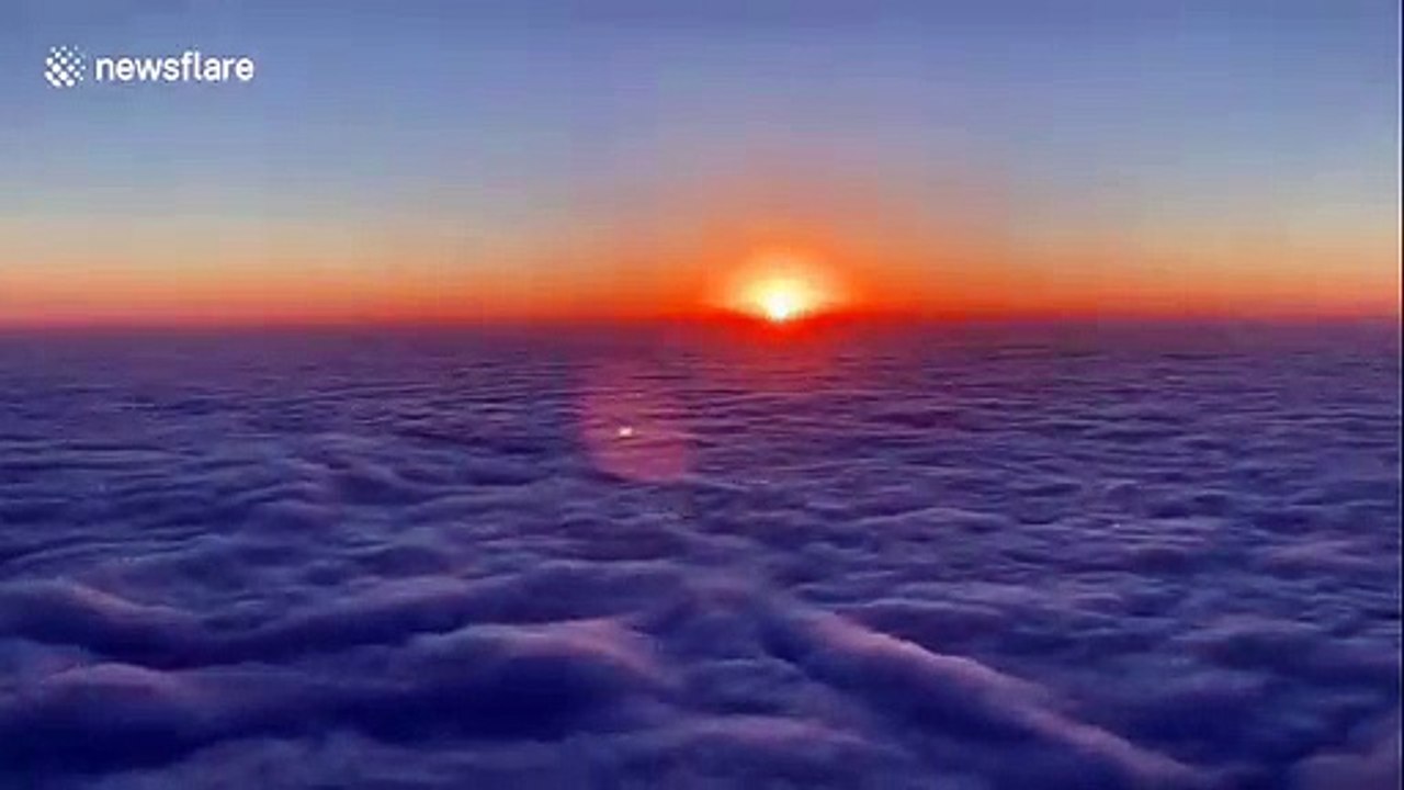 Gorgeous time-lapse shows sunrise over clouds roiling like waves