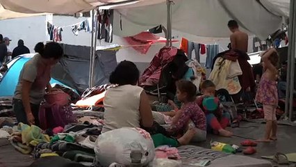 Migrants camped out in Mexico attend job fair