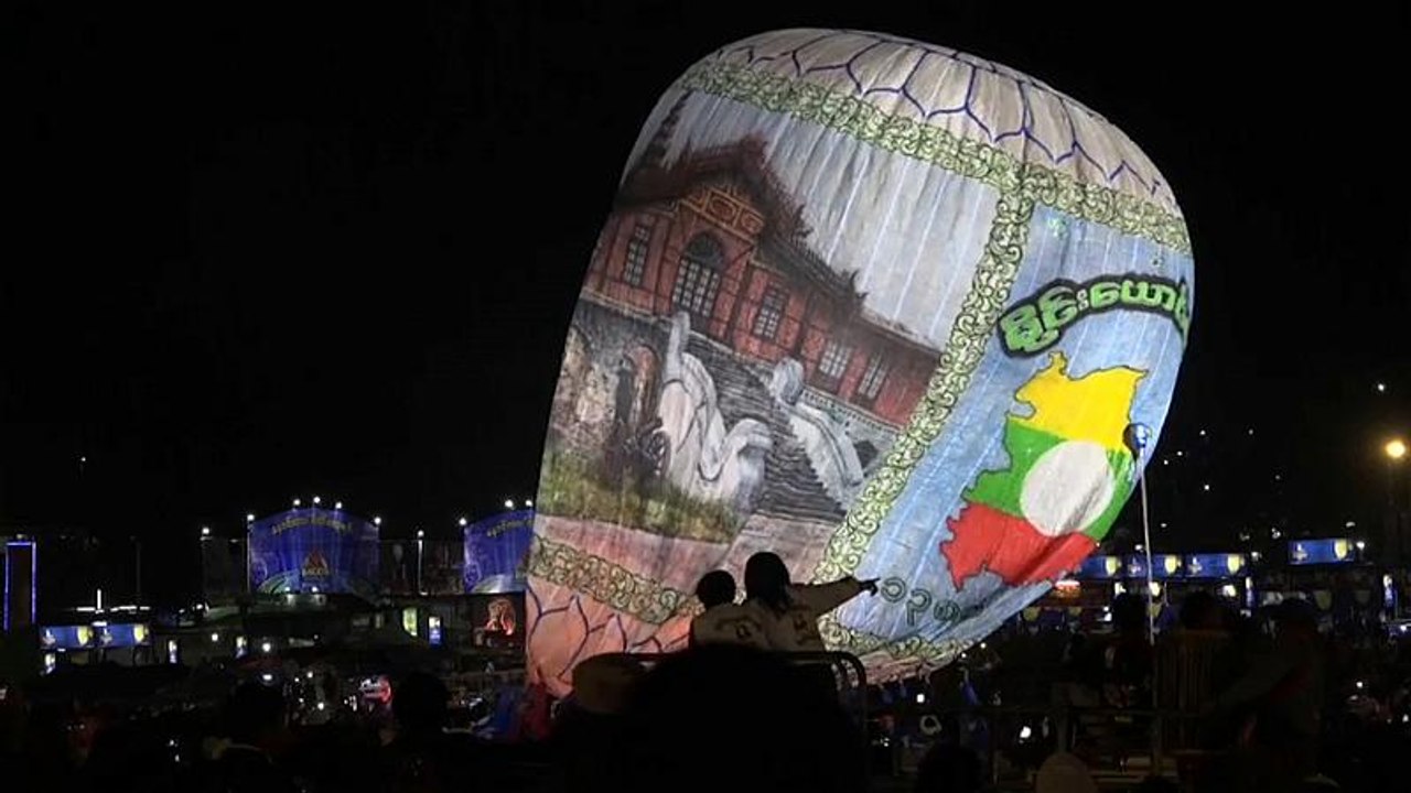 Exploding hot air balloon injures revellers at...
