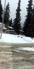 Playful Police Officer Joins in Snowball Fun