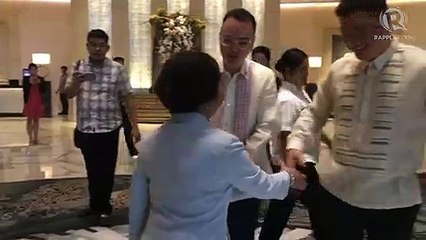 Arroyo and Cayetano greet one another after Chinese President Xi Jinping