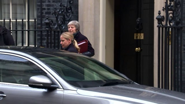 Theresa May departs Downing Street ahead of PMQs