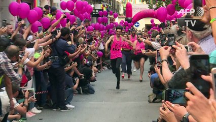 Fun at Madrid's Gay Pride as high heel racing takes place