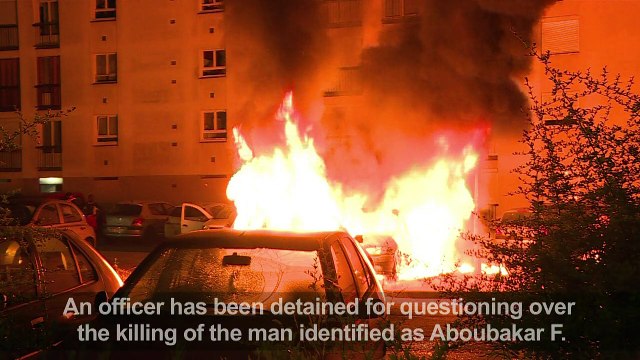 French policeman held over killing that sparked riots