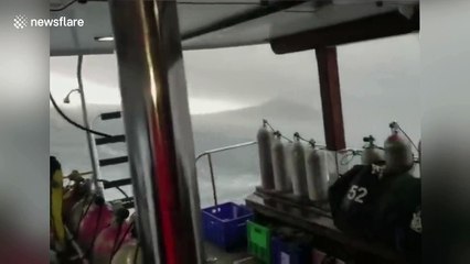 Footage shows tourist boat struggling in violent storm before it capsized off Thailand