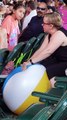 Woman Pops Kids Beach-Ball at Concert