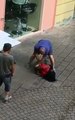 Nigerian Girl From Edo State Fighting A Nigerian Man On The Streets Of Italy Trying To Stab Him To Death