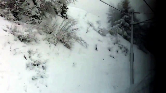 Train journey in deep snow through the alps, from Tyrol to Verona, Italy