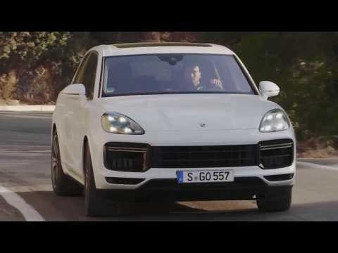 Porsche Cayenne Turbo Carrara White Metallic Driving on the road