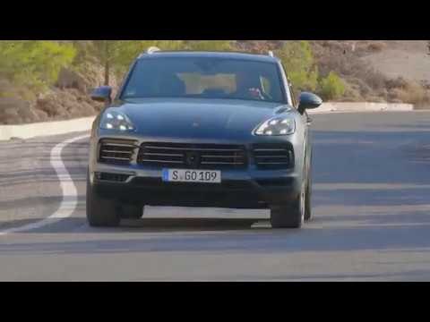 Porsche Cayenne Biskaya Blue Metallic Driving on the road