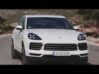 Porsche Cayenne in White Driving on the road