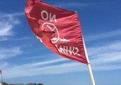 Red 'No Swimming' Flags Fly at Nags Head with Tropical Storm Chris Offshore