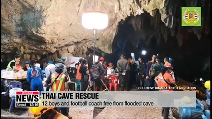 12 boys and football coach free from flooded Thai cave