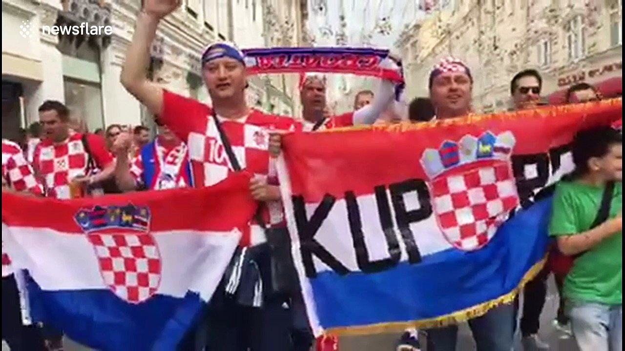 Croatia supporters march through the streets of Moscow ahead of England clash