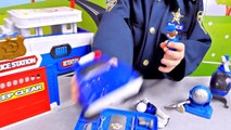 Playing with policemen. Toy police station and a new cop uniform Videos for kids. Unpacking of a toy