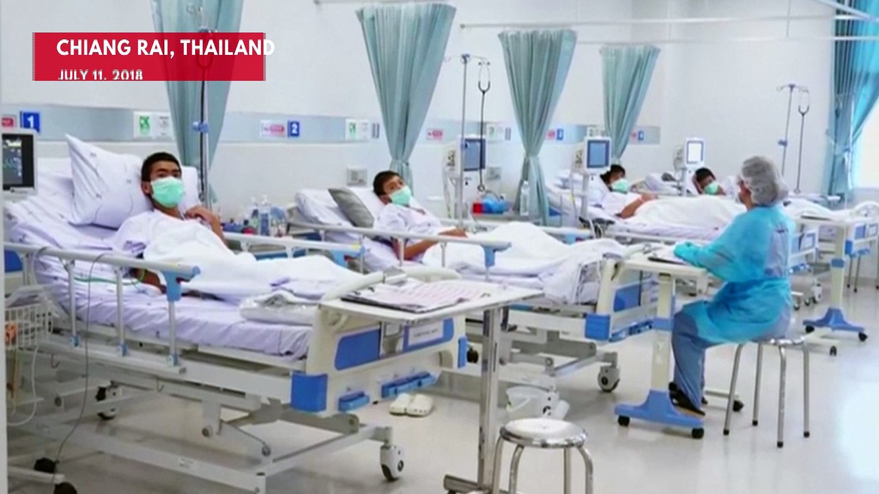 Thai Cave Boys Shown Making Peace Signs In Hosp...