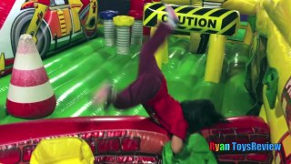 Ryan plays on HUGE Indoor playground GIANT INFLATABLE SLIDES