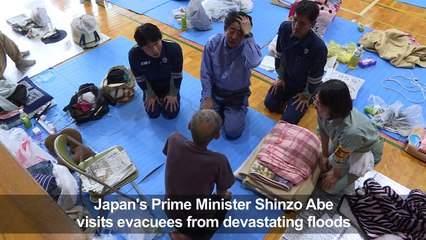 Japan PM meets stranded evacuees in flood disaster zone