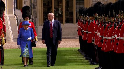 Queen ushers Donald Trump along as he inspects Guards