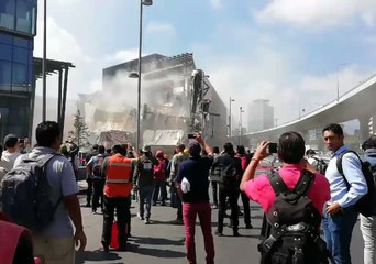 Download Video: Bystanders Gather Around Collapsed Shopping Mall in Mexico City