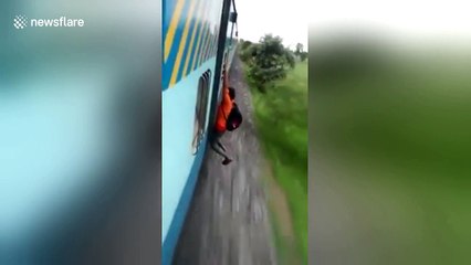 Indian man falls off speeding train when stunt goes wrong