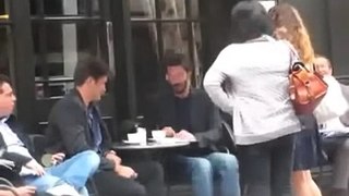 Keanu Reeves meeting fans at a cafe