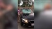 Angry wife takes a sledgehammer to her husband's BMW when she discovered he had been cheating on her