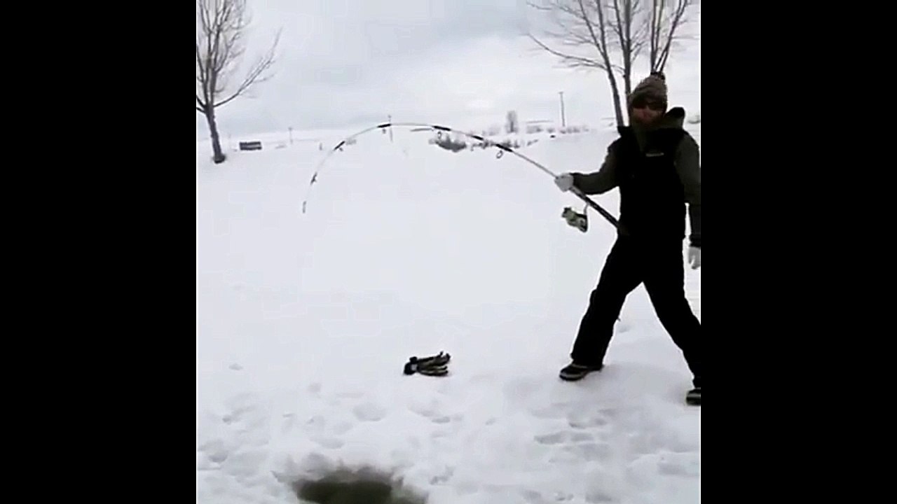 Fishing a Giant Sturgeon Through the Ice