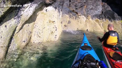 Mini-rainbow formed in Isle of Man cave by powerful water spray