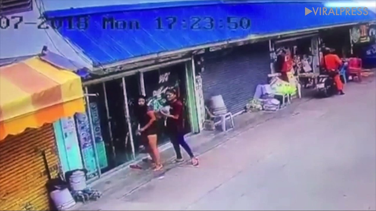 Two friends calmly wipe the blood from their hands after 'slitting hairdresser's throat'