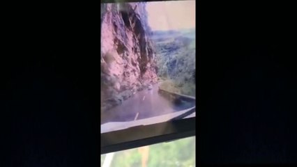 Huge boulder lands on moving car in southern China
