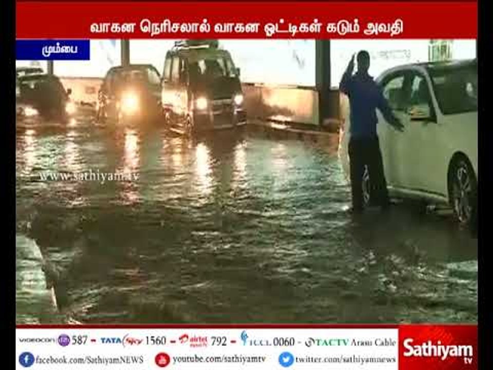 As rain water is Stagnant on road, Motorists have difficulty in driving due to rainfall