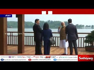 பிரதமர் மோடி சீன அதிபர் ஜின்பிங்கும் ஊகான் நகரில் படகில் பயணித்த படி, தேனீர் அருந்தி பேச்சுவார்த்தை