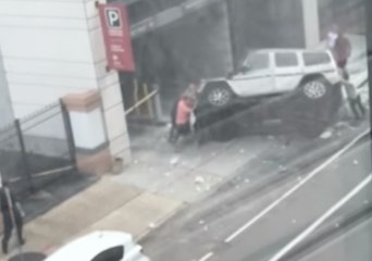 New Orleans Football Player, Bystanders Overturn Car That Fell From Garage