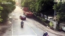 Scooter rear-ends lorry reversing on road