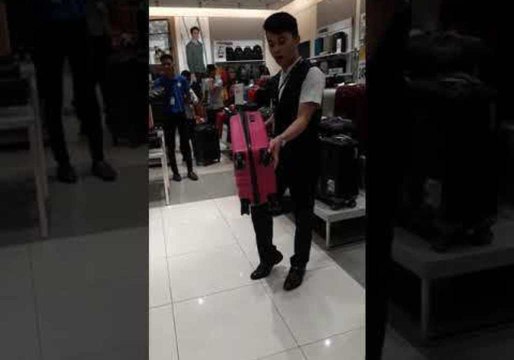 Luggage Salesman Stuns Shoppers With Incredible Demonstration That Ends in Splits