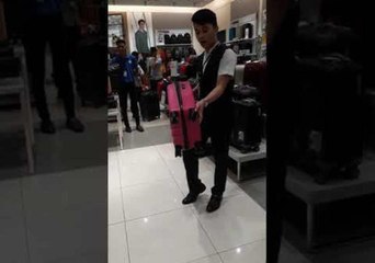 Luggage Salesman Stuns Shoppers With Incredible Demonstration That Ends in Splits