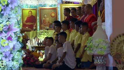 Rescued Thai footballers attend Buddhist ceremony near cave