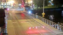 US cyclist ignores warning barriers and falls into drawbridge gap