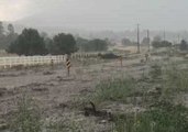 Torrent of Muddy Water Flows Down Road Near Flagstaff as Shelters Opened to Support Flood Victims