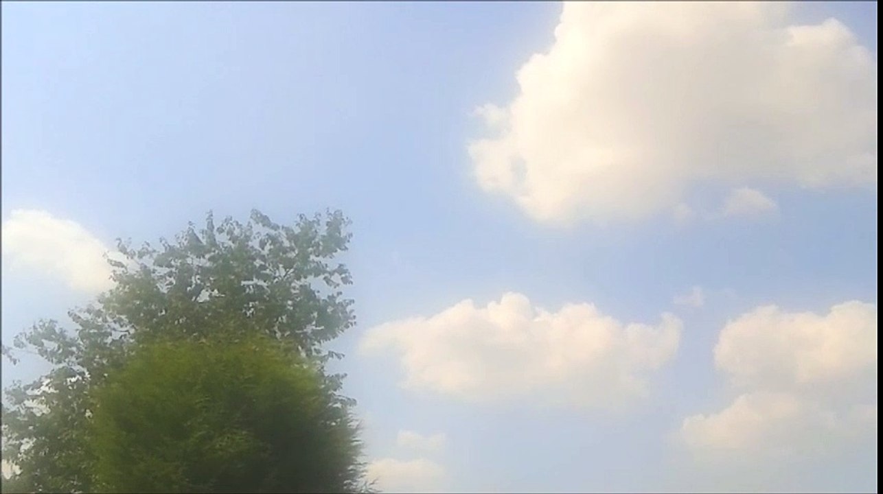 Blue Sky with White Fluffy Clouds