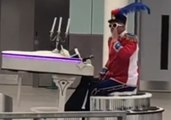 'Well, That's Different': Elton John Impersonator Glides Through Gatwick Airport