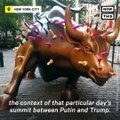 The Wall Street bull was covered in dildos by an activist in a Putin mask